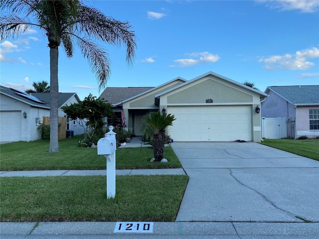 1210 Etchfield Cir, Brandon, FL 33511 - ranch-style home with an attached garage, driveway, stucco siding, and a gate
