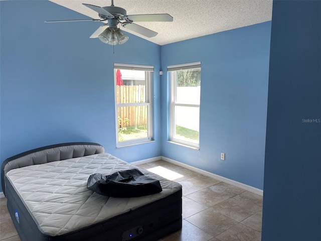 1210 Etchfield Cir, Brandon, FL 33511 - bedroom featuring a textured ceiling, lofted ceiling, and ceiling fan