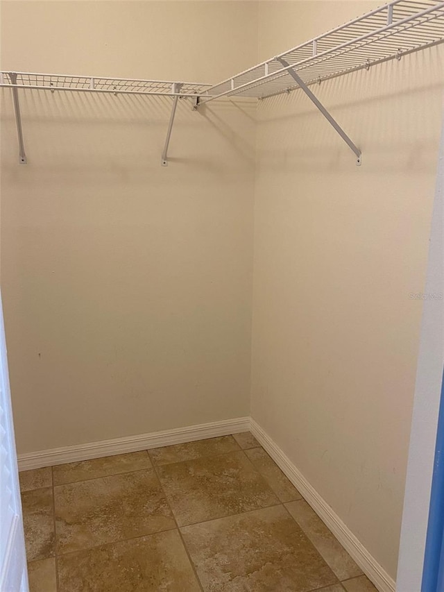 1210 Etchfield Cir, Brandon, FL 33511 - spacious closet with light stone finish floors