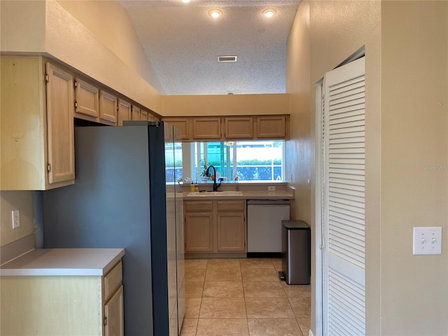 1210 Etchfield Cir, Brandon, FL 33511 - kitchen featuring dishwasher, freestanding refrigerator, vaulted ceiling, light tile patterned flooring, and light countertops