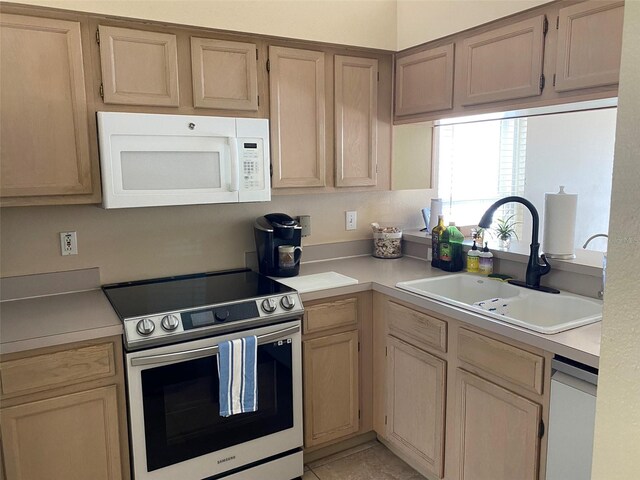 1210 Etchfield Cir, Brandon, FL 33511 - kitchen featuring white microwave, stainless steel electric range, light countertops, dishwashing machine, and light brown cabinets