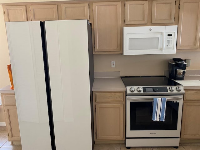 1210 Etchfield Cir, Brandon, FL 33511 - kitchen featuring white appliances, light countertops, light brown cabinets, and light tile patterned floors