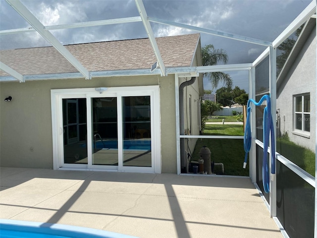 1210 Etchfield Cir, Brandon, FL 33511 - back of house with a shingled roof, a patio area, stucco siding, and a lanai