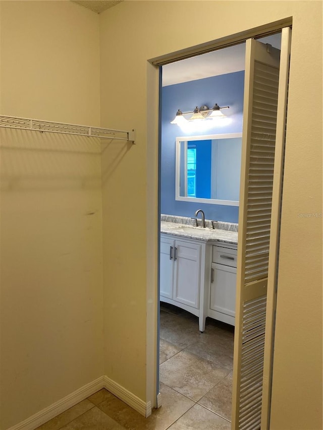 1210 Etchfield Cir, Brandon, FL 33511 - spacious closet with a sink and light tile patterned floors