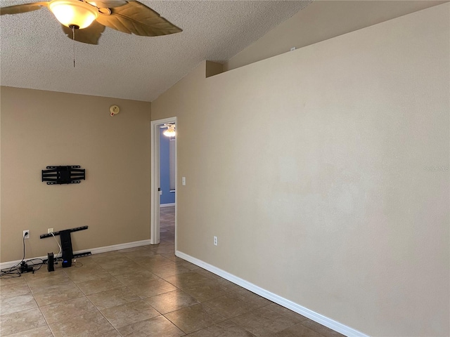 1210 Etchfield Cir, Brandon, FL 33511 - spare room featuring vaulted ceiling, a textured ceiling, ceiling fan, and tile patterned flooring