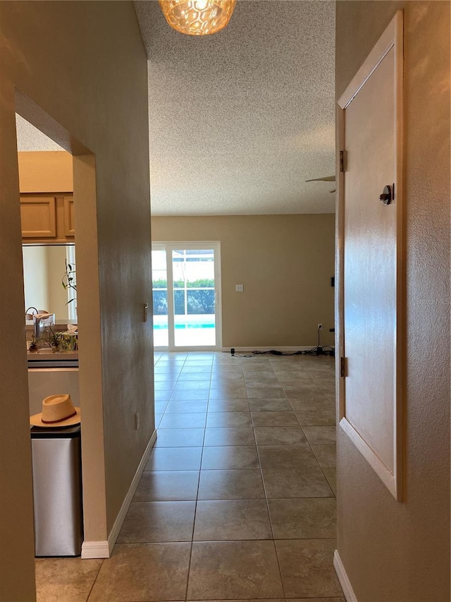 1210 Etchfield Cir, Brandon, FL 33511 - hallway with tile patterned flooring and a textured ceiling