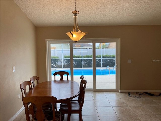 1210 Etchfield Cir, Brandon, FL 33511 - dining space featuring a textured ceiling and light tile patterned flooring