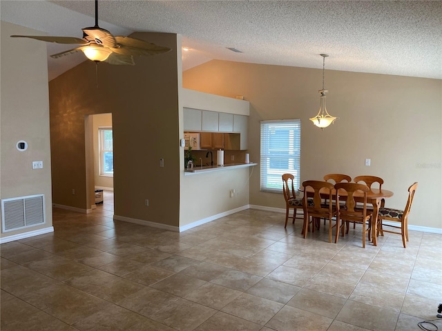 1210 Etchfield Cir, Brandon, FL 33511 - tiled dining room with a ceiling fan, a textured ceiling, and high vaulted ceiling