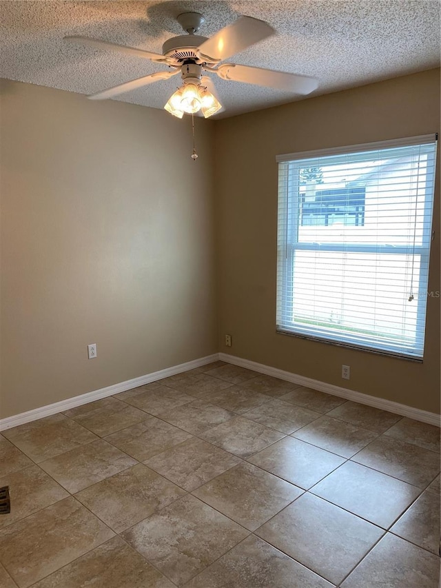 1210 Etchfield Cir, Brandon, FL 33511 - spare room featuring ceiling fan, a textured ceiling, and tile patterned flooring