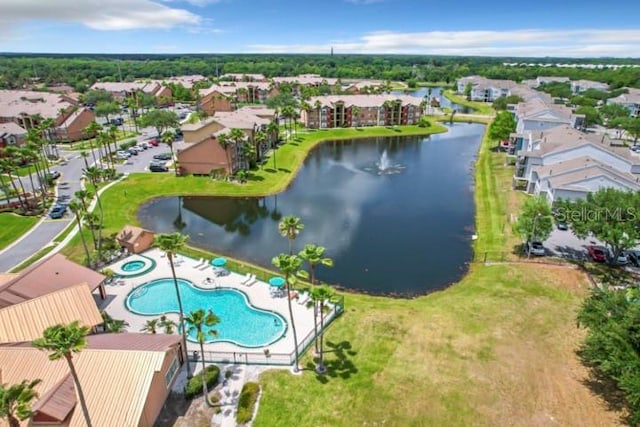 bird's eye view of a nearby body of water and a pool