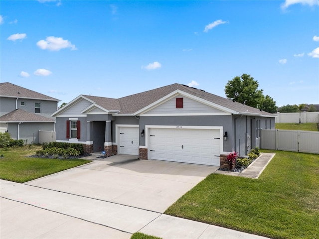 view of front of property featuring a gate, fence, a garage, concrete driveway, and a front lawn