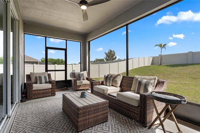 sunroom with an outdoor living space and a ceiling fan