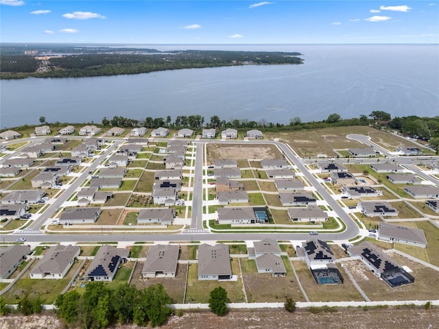 aerial view featuring a residential view and a water view