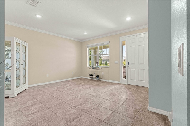 entrance foyer with visible vents, baseboards, and crown molding