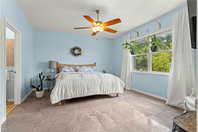 bedroom with baseboards and a ceiling fan