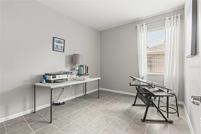 tiled home office featuring baseboards