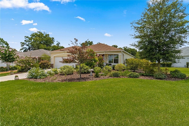 ranch-style house with a garage, a front yard, and concrete driveway