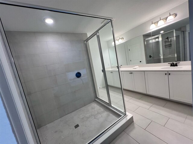 832 Benoi Dr, Davenport, FL 33896 - full bathroom with a shower stall, a sink, tile patterned flooring, and double vanity