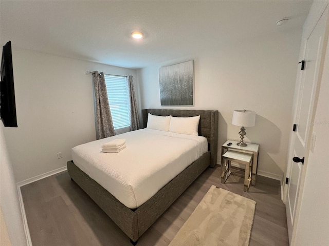 832 Benoi Dr, Davenport, FL 33896 - bedroom with baseboards and wood finished floors