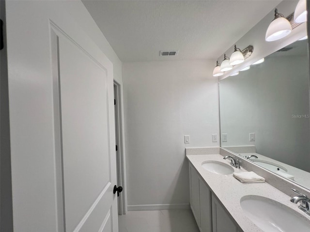 832 Benoi Dr, Davenport, FL 33896 - bathroom featuring double vanity, a sink, and visible vents
