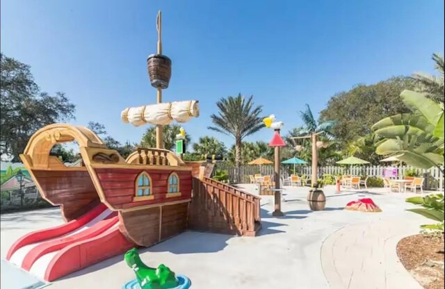 832 Benoi Dr, Davenport, FL 33896 - view of jungle gym featuring fence and a patio