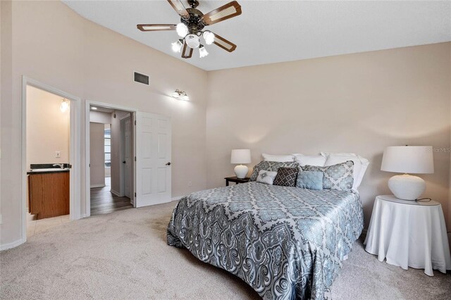 bedroom featuring baseboards, visible vents, carpet flooring, and a ceiling fan
