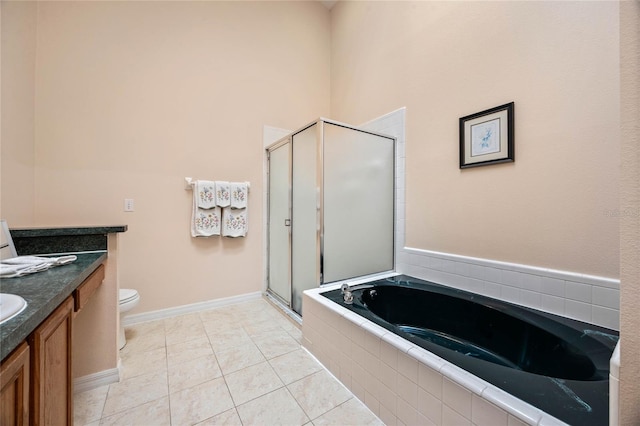 bathroom with a bath, a shower stall, toilet, vanity, and tile patterned flooring