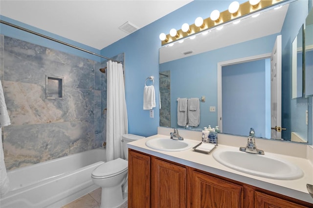 bathroom featuring toilet, a sink, shower / bath combo, and visible vents