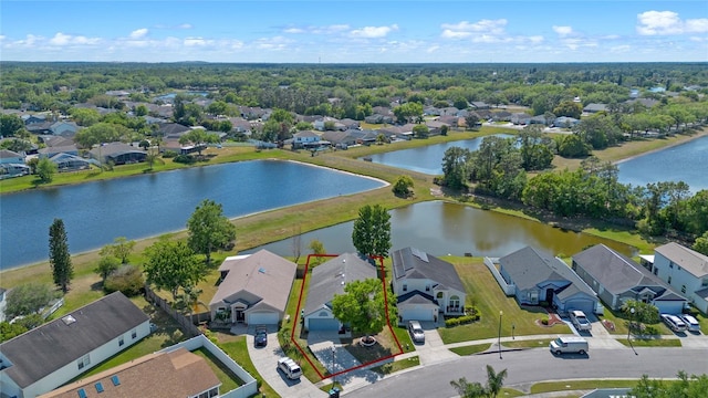 aerial view with a residential view and a water view