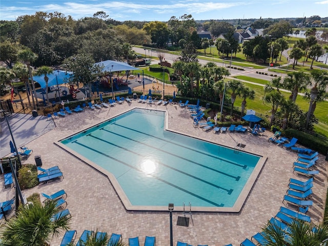 pool with fence and a patio area