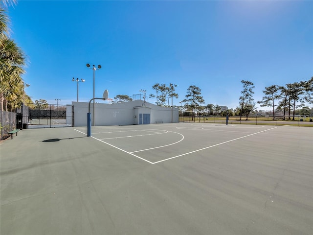view of basketball court featuring fence and community basketball court