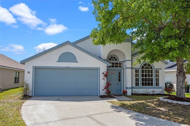 408 Lexingdale Dr, Orlando, FL 32828 - view of front of property with concrete driveway, stucco siding, and a garage