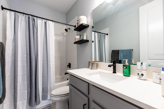 bathroom featuring toilet, vanity, and shower / bath combo