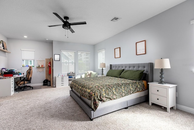 bedroom featuring light carpet, baseboards, multiple windows, and visible vents