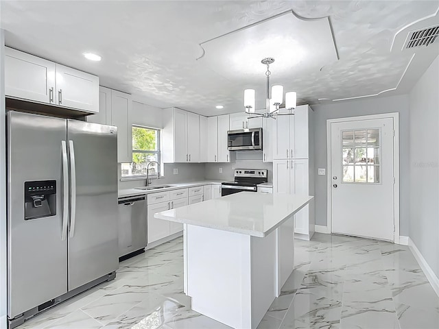 123 Shenandoah Ave, Lady Lake, FL 32159 - kitchen with marble finish floor, visible vents, a sink, and stainless steel appliances