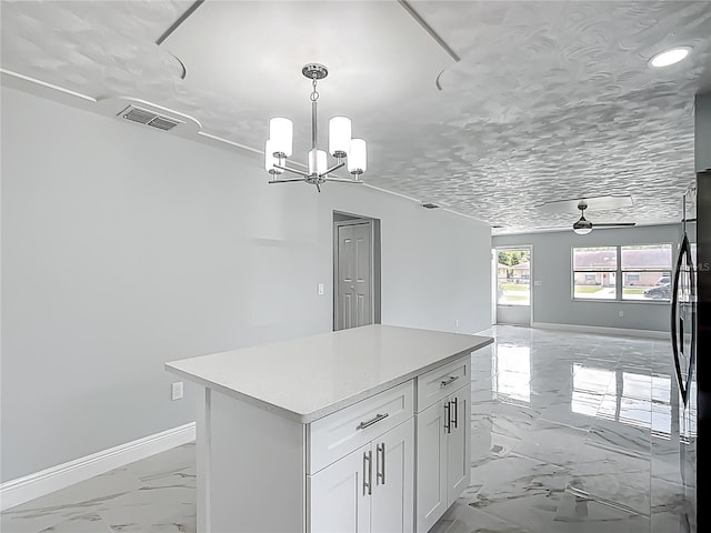 123 Shenandoah Ave, Lady Lake, FL 32159 - kitchen featuring black refrigerator, open floor plan, marble finish floor, baseboards, and visible vents
