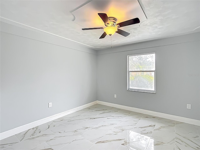 123 Shenandoah Ave, Lady Lake, FL 32159 - empty room with marble finish floor, baseboards, and ceiling fan