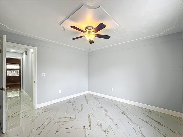 123 Shenandoah Ave, Lady Lake, FL 32159 - spare room with a ceiling fan, marble finish floor, and baseboards