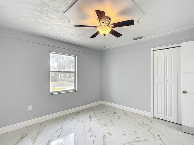 123 Shenandoah Ave, Lady Lake, FL 32159 - spare room featuring baseboards, marble finish floor, visible vents, and a ceiling fan