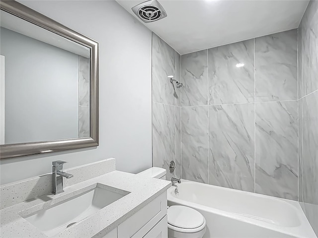 123 Shenandoah Ave, Lady Lake, FL 32159 - full bathroom featuring toilet, vanity, shower / bathtub combination, and visible vents