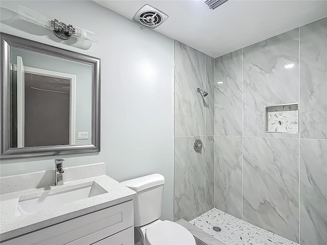 123 Shenandoah Ave, Lady Lake, FL 32159 - bathroom with toilet, vanity, a shower stall, and visible vents