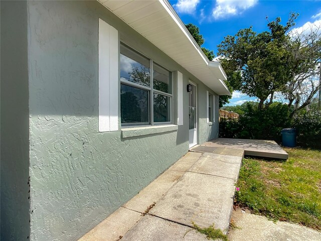 123 Shenandoah Ave, Lady Lake, FL 32159 - view of home's exterior featuring stucco siding