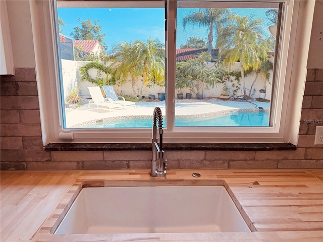 7808 The Esplanade Ct, Orlando, FL 32836 - kitchen view of a sink and wooden counters