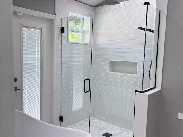 7808 The Esplanade Ct, Orlando, FL 32836 - bathroom featuring a stall shower and a freestanding bath