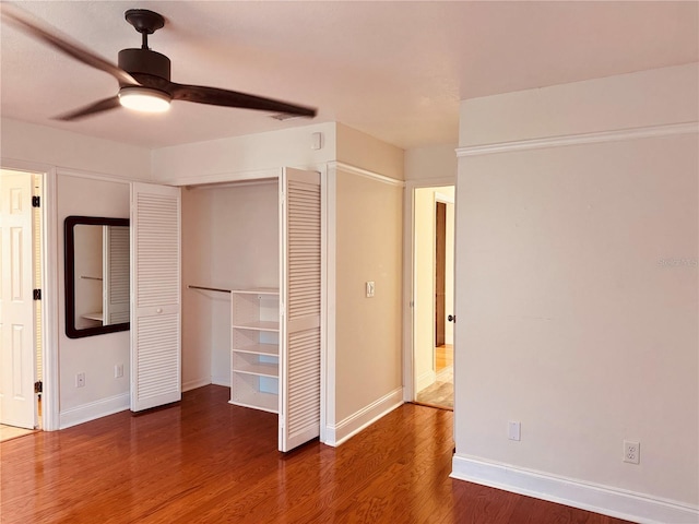 7808 The Esplanade Ct, Orlando, FL 32836 - unfurnished bedroom with wood finished floors, a closet, and a ceiling fan
