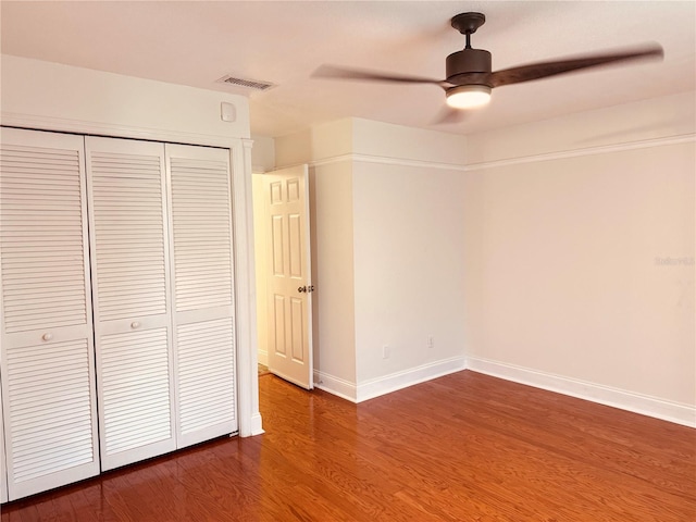 7808 The Esplanade Ct, Orlando, FL 32836 - unfurnished bedroom featuring wood finished floors, a closet, and ceiling fan