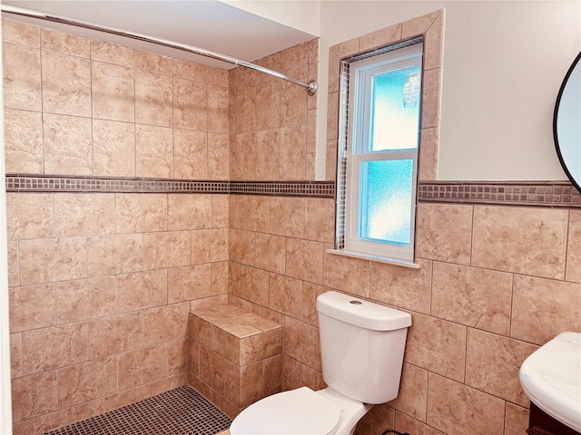 7808 The Esplanade Ct, Orlando, FL 32836 - bathroom featuring tile walls, a tile shower, plenty of natural light, and vanity