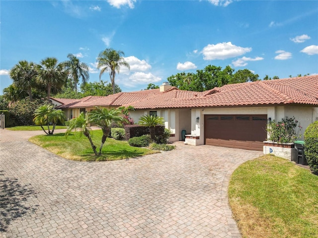 7808 The Esplanade Ct, Orlando, FL 32836 - view of front of house featuring stucco siding, a garage, decorative driveway, and a chimney
