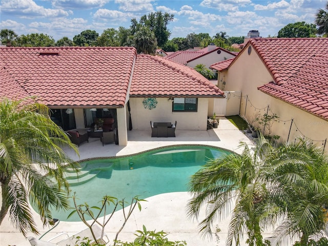 7808 The Esplanade Ct, Orlando, FL 32836 - view of pool with a patio area and an outdoor living space