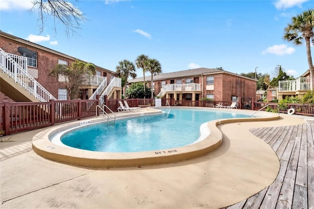 480 Banyon Tree Cir Unit 100, Maitland, FL 32751 - community pool featuring stairs, fence, and a deck